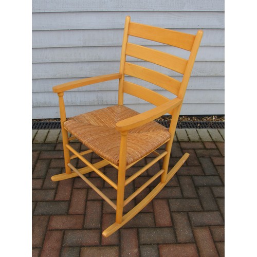 9354 - A Danish beech rocking chair with woven rush seat