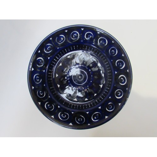 9021A - An Arabia of Finland charger in deep blue glaze. Signed verso.   34.5cm diameter