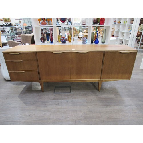 9345A - A Mcintosh Furniture sideboard with three cupboard doors and three drawers. 201.5cm x  49cm x 77cm h... 