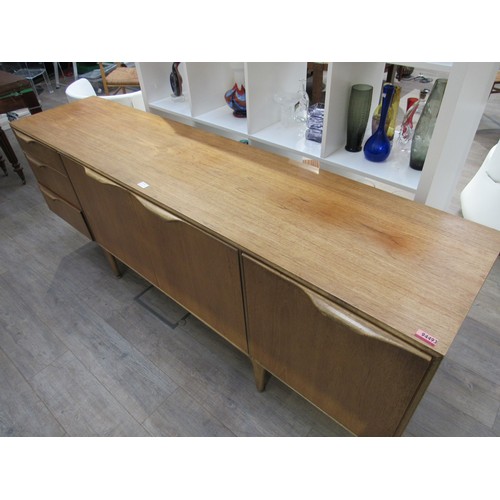 9345A - A Mcintosh Furniture sideboard with three cupboard doors and three drawers. 201.5cm x  49cm x 77cm h... 