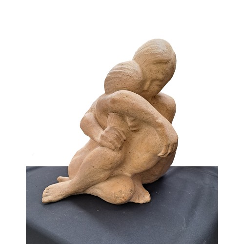 9369 - A studio ceramic sculptural maquette figural group of an embracing couple. Indistinctly signed to on... 