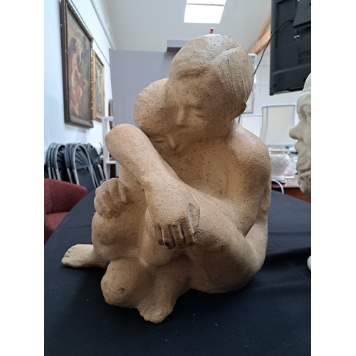 9369 - A studio ceramic sculptural maquette figural group of an embracing couple. Indistinctly signed to on... 