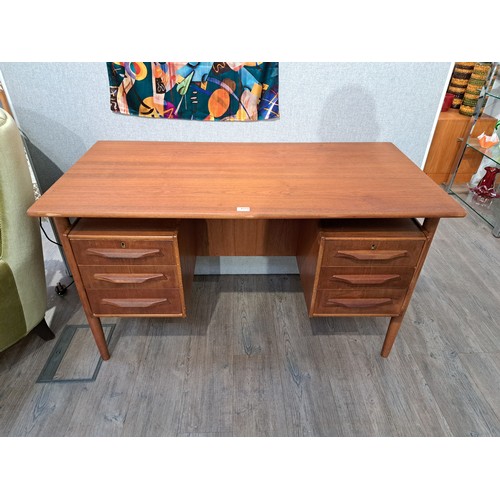 9333 - A Danish teak twin pedestal desk with six drawers, open 'bookshelf' back. 130cm x 66cm x 75.5cm high