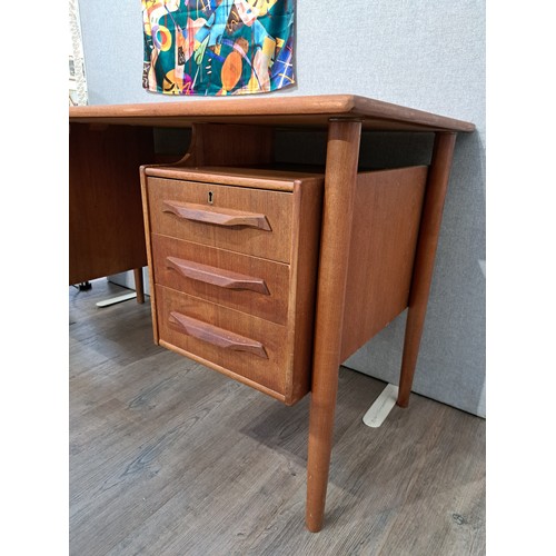 9333 - A Danish teak twin pedestal desk with six drawers, open 'bookshelf' back. 130cm x 66cm x 75.5cm high