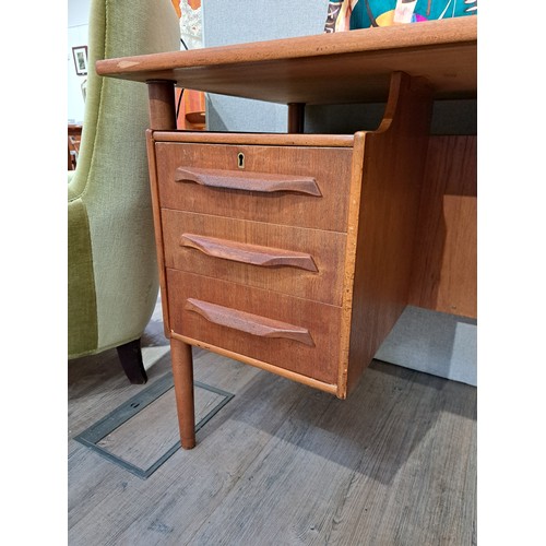 9333 - A Danish teak twin pedestal desk with six drawers, open 'bookshelf' back. 130cm x 66cm x 75.5cm high