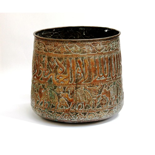 1003 - A large Eastern copper pot with text, foliate and fauna relief, hammered decoration, 40cm diameter x... 