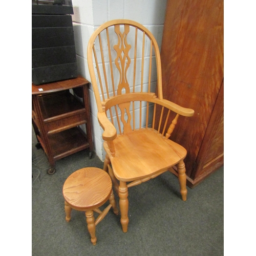 1126 - A Windsor beech armchair and circular stool