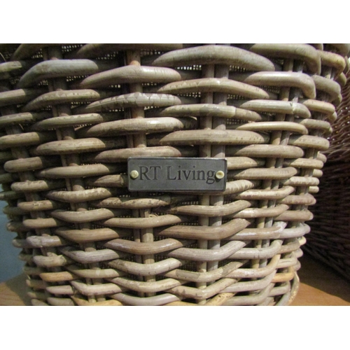 1134 - A sack lined twin handled wicker log basket, 48cm high x 52cm diameter