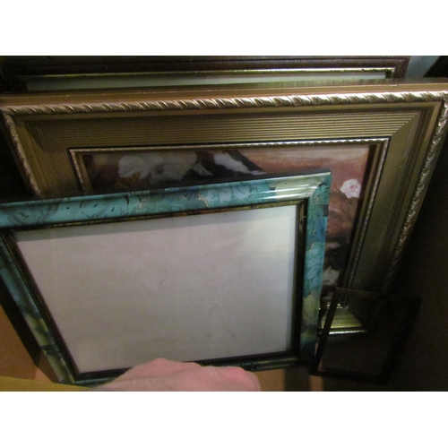 1233 - A box of miscellaneous: picture frames & mirrors, a set of four painted shelves and four still life ... 