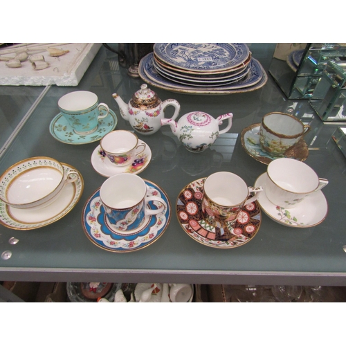 1521A - A selection of cups and saucers including Royal Crown Derby 