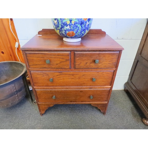 1014 - A 1940's oak chest of two short over two long drawers, 80cm high x 71cm wide x 39cm deep