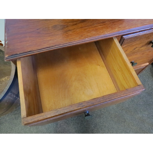 1014 - A 1940's oak chest of two short over two long drawers, 80cm high x 71cm wide x 39cm deep