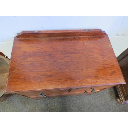 1014 - A 1940's oak chest of two short over two long drawers, 80cm high x 71cm wide x 39cm deep