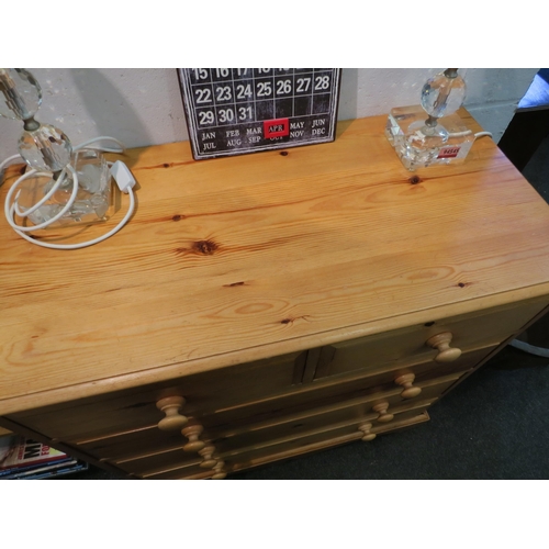 1023 - A modern pine chest of two short over three long drawers, shaped plinth base, 93cm high x 92cm wide ... 