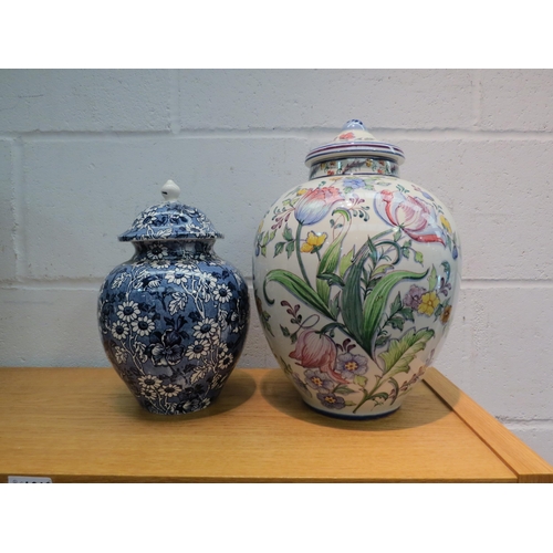 1024 - Two large floral decorated lidded jars.  Tallest made in Portugal, 32cm height.  Blue and white (Jam... 