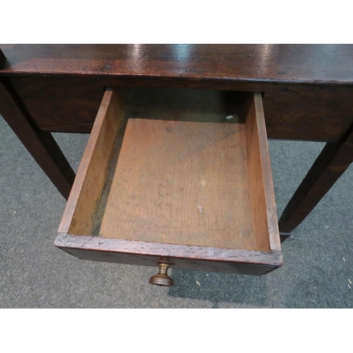 1110 - An oak two tier lamp table with single drawer, tapering legs to spade feet, 76cm high x 51cm wide x ... 