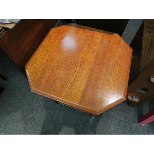 1113 - An Edwardian walnut occasional table with canted corner top over turned supports and spindle gallery... 