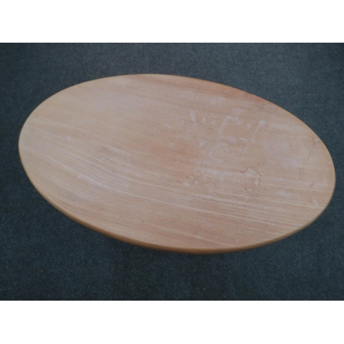 1125 - A rustic oak stool, oval-top, 46cm high x 75cm long