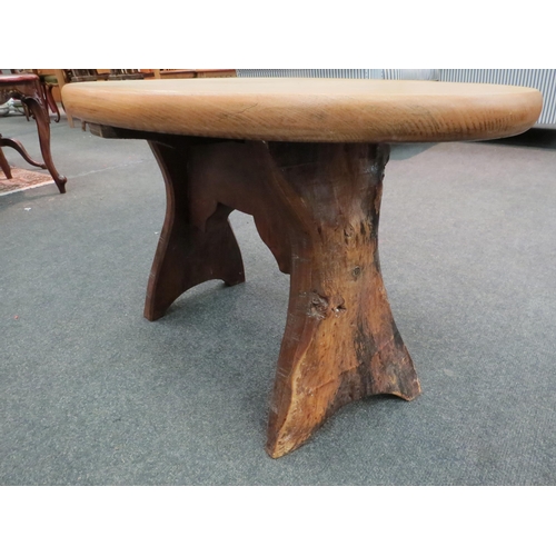 1125 - A rustic oak stool, oval-top, 46cm high x 75cm long