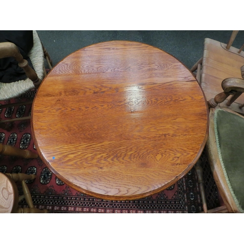 1129 - A Georgian style honey oak tripod wine table, 60cm high x 69cm diameter