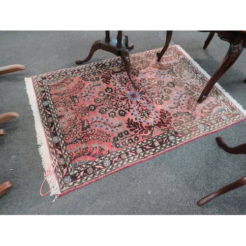 1136 - Two late 20th Century Eastern wool rugs, pink ground with geometric gulls and floral design