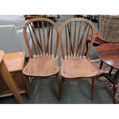 1159 - A set of four 19th Century hooped stick-back chairs on 'H' stretchers with solid elm seats