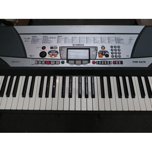 1219 - A Yamaha PSR-GX76 keyboard with cover and stand