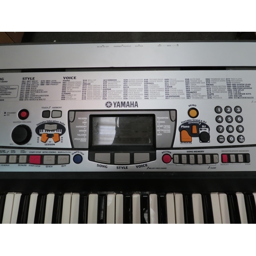 1219 - A Yamaha PSR-GX76 keyboard with cover and stand