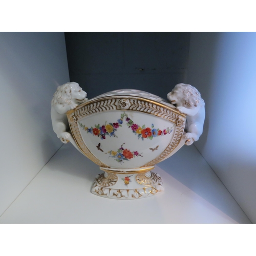 1275 - A Continental porcelain flower bowl with lion-shaped handles, faded mark to base, 17cm high