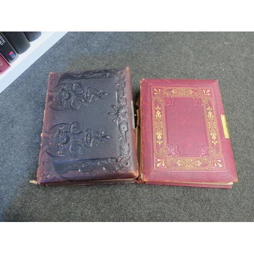 1284 - Two leather bound photo albums containing part contents