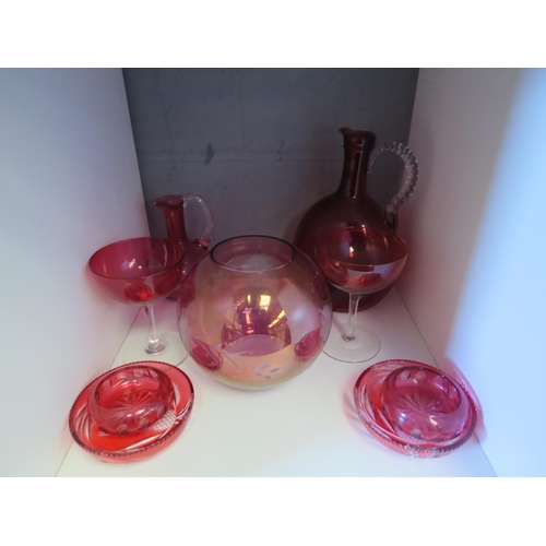 1294 - A selection of Cranberry glass including beakers, sugar caster, champagne saucers, approximately 30 ... 