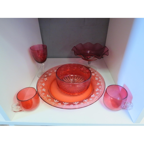 1294 - A selection of Cranberry glass including beakers, sugar caster, champagne saucers, approximately 30 ... 