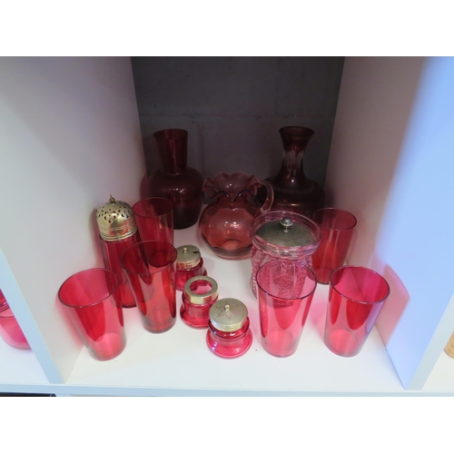 1294 - A selection of Cranberry glass including beakers, sugar caster, champagne saucers, approximately 30 ... 