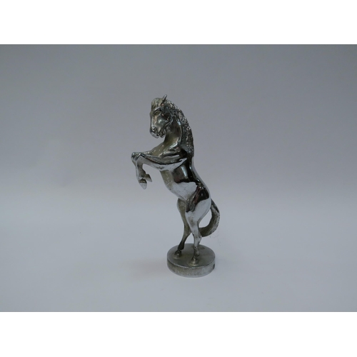 1303 - A white metal mascot of a rearing horse, reputedly sold by Swaine Adeney & Briggs         (E) £30-40