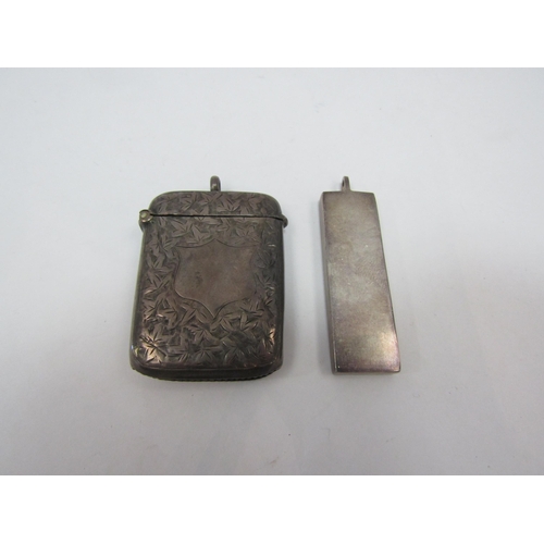 1353 - A silver vesta case and a silver ingot pendant