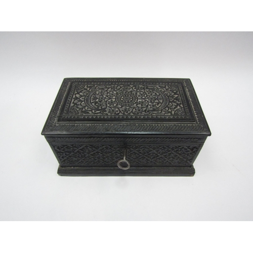 1366 - An ebony box with all over carved decoration containing miniature portraits, fob watches, stamp case... 