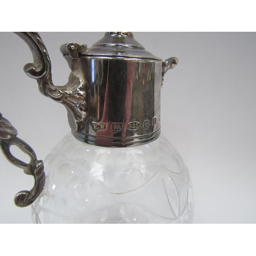 1377 - A small etched glass ewer with silver top having an acorn knop.  16cm high