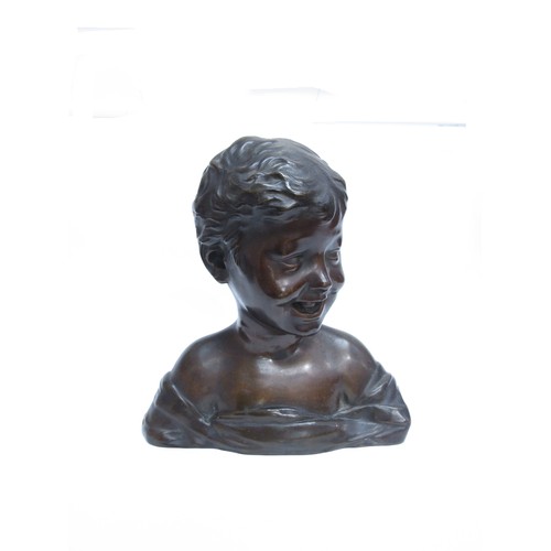 8085 - A bronze bust of a smiling young boy, marked 'H. Luppens & Cie' to the shoulder. 30cm high.