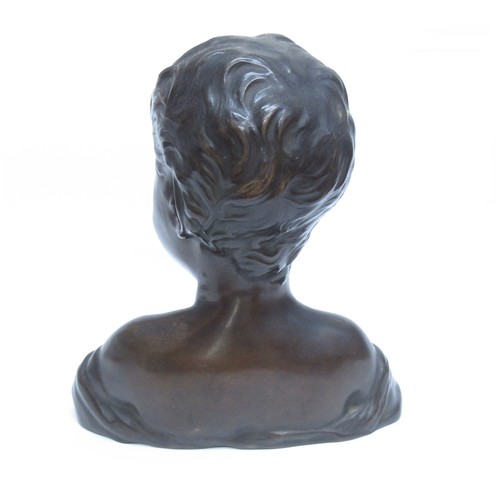 8085 - A bronze bust of a smiling young boy, marked 'H. Luppens & Cie' to the shoulder. 30cm high.