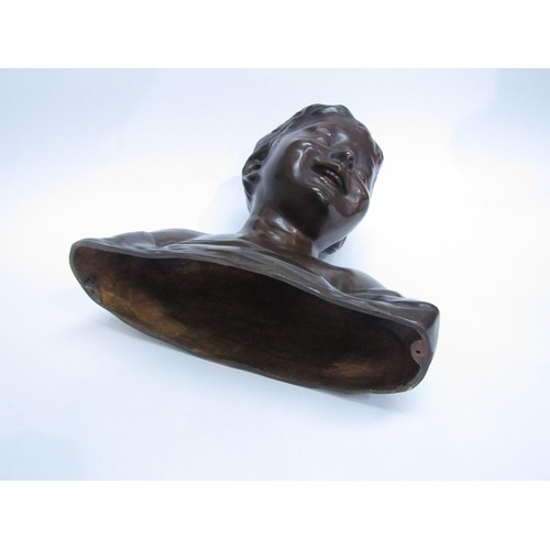 8085 - A bronze bust of a smiling young boy, marked 'H. Luppens & Cie' to the shoulder. 30cm high.