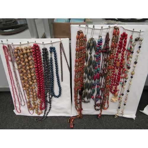 1254 - A quantity of costume necklaces, brooches and earrings etc