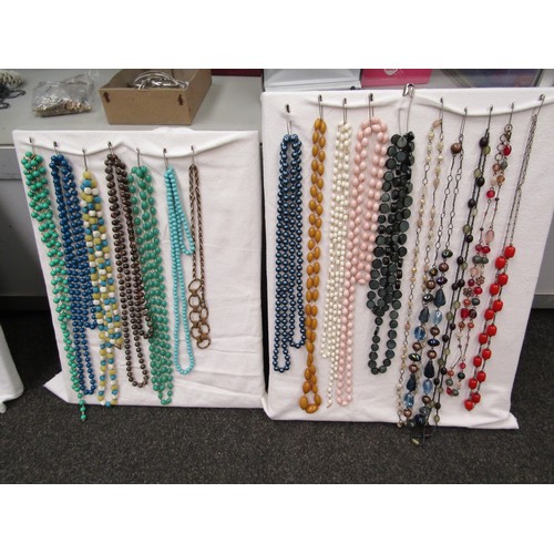 1254 - A quantity of costume necklaces, brooches and earrings etc