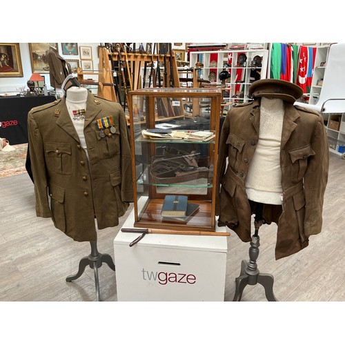 9001 - A WWI officer's jacket and peaked cap together with medals, holster, Sam Browne belt with frog and e... 