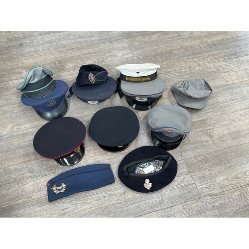 9050 - Two boxes of mixed headwear and webbing including post war British and German