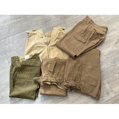 9051 - A box containing three pairs of 1949 pattern battledress trousers, service dress trousers 1966 and j... 