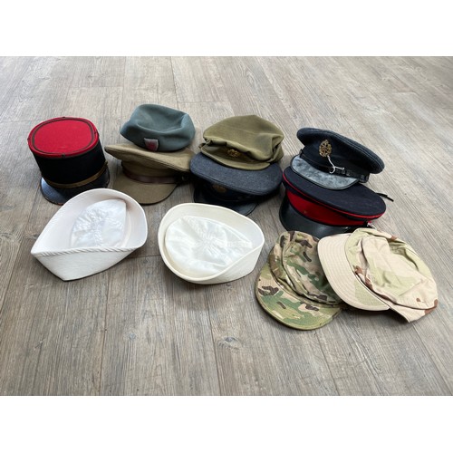 9054 - A box of mixed headwear including King's crown peaked cap, mid Century kepi and RAF       (C)