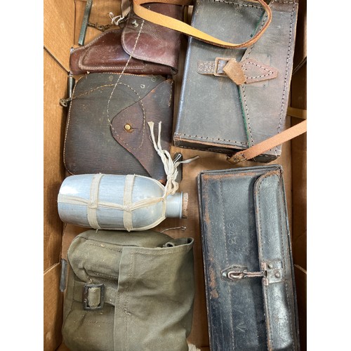 9056 - A box of mixed militaria including WWI and 1944 pattern pouches, holster etc