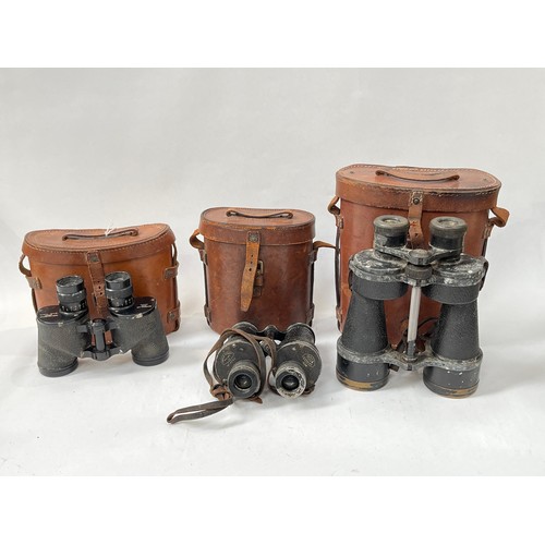 9069 - Three pairs of WWII British binoculars with leather cases         (C)