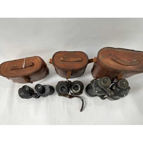 9069 - Three pairs of WWII British binoculars with leather cases         (C)