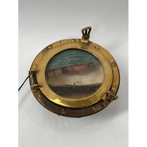 9072 - A vintage brass framed porthole, illuminated. COLLECTORS ELECTRICAL ITEM: REWIRING REQUIRED